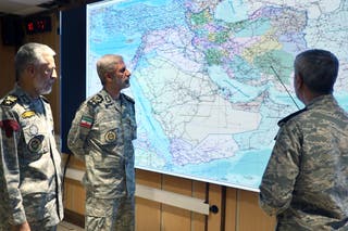Iran's Messenger General, Amir Hatami, Center, Admiral Mahmoud Mousavi, Right and Admiral Habibollah Sayyari attend meeting in the central seat of Zolfaghara in Iran in Iran